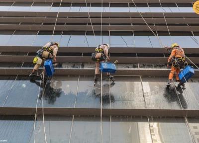 مردان عنکبوتی شیشه پاک کن آسمان خراش های قطر